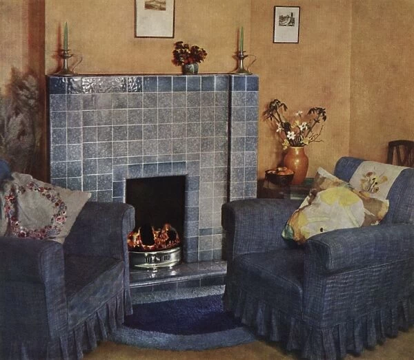 1930s living room with fireplace and chairs