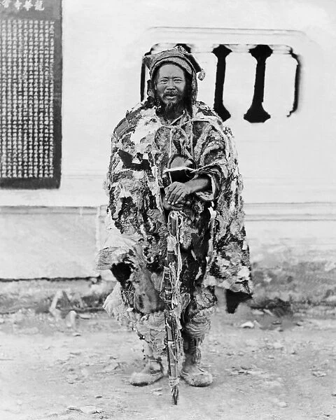 Beggar in ragged clothes, China