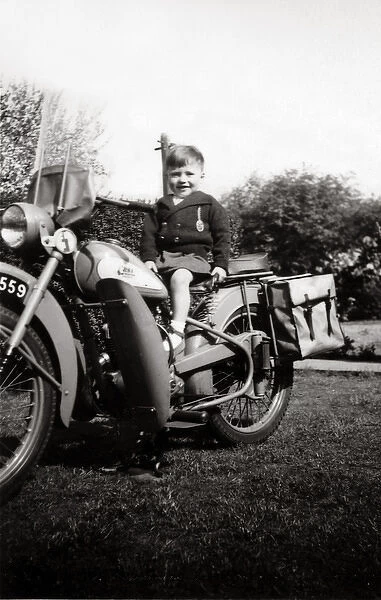 Boy on a 1951  /  2 BSA Bantam motorcycle
