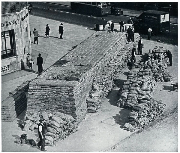 Construction of sandbag air raid shelter, September 1939