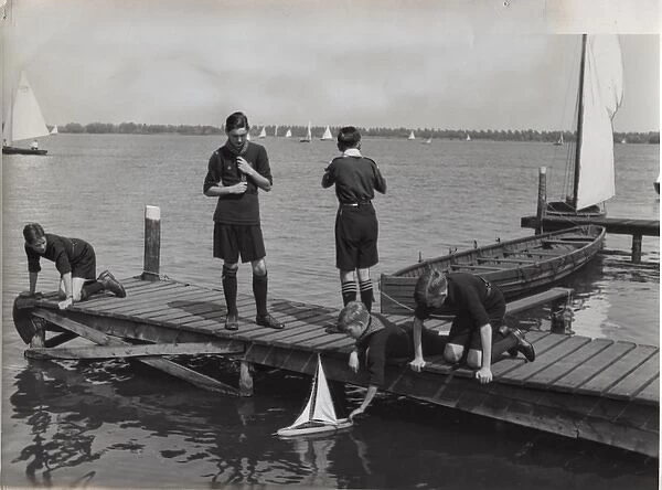 Dutch scouts with model sailing boat, Holland