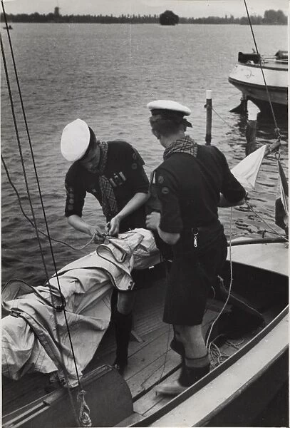 Dutch sea scouts on sailing boat, Holland