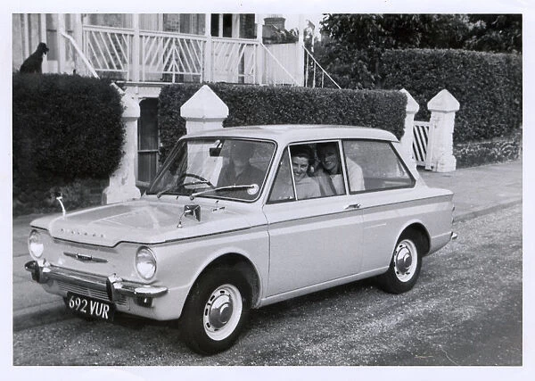 A family out for a drive in their new Hillman Imp
