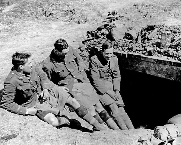 Gordon Highlanders relax outside dugout, WW1