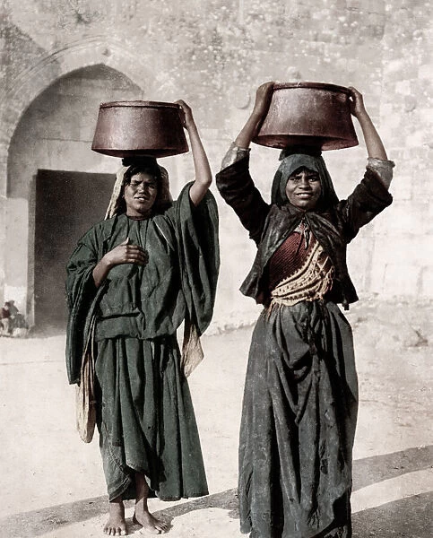 Israel Palestine - women from Siloam carrying water