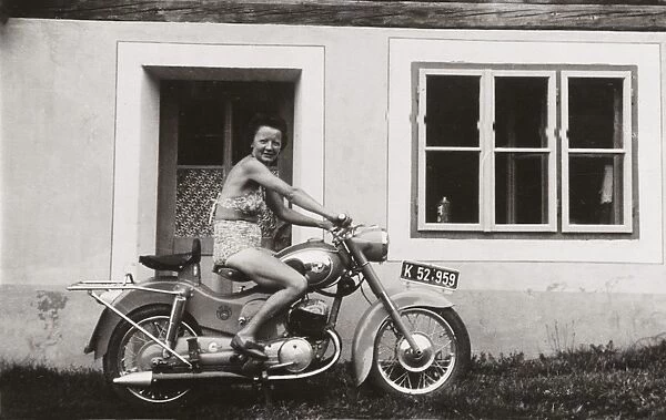 Lady on a 1958  /  9 Puch motorcycle