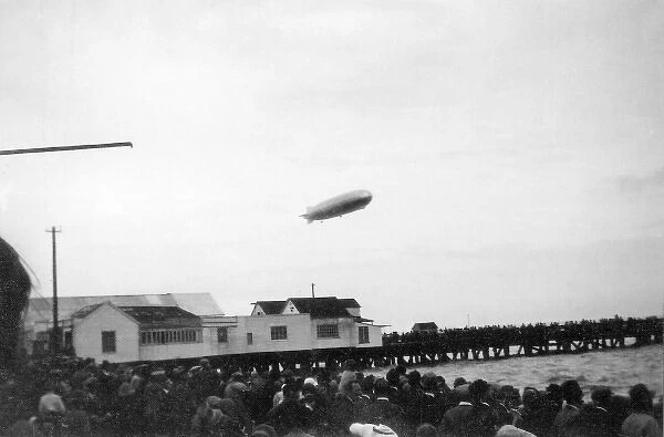 LZ 127 Graf Zeppelin over pier, Walton, Essex