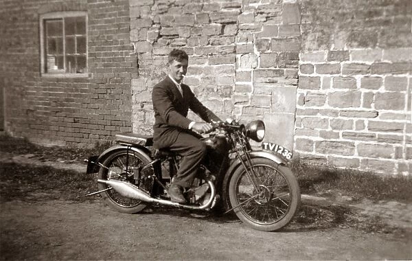 Man sitting on 1929  /  30 BSA motorcycle