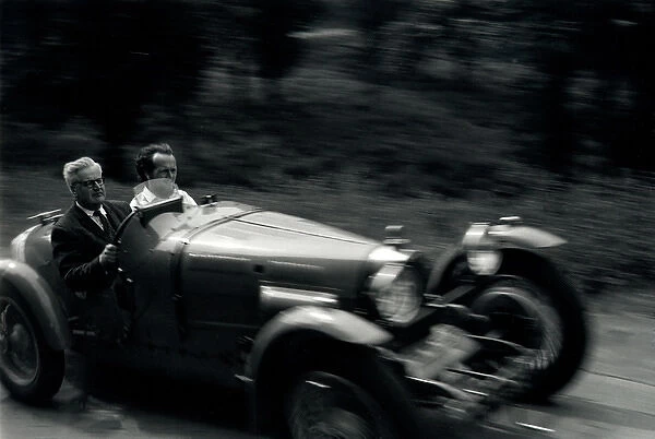 Two men in a Bugatti sports car