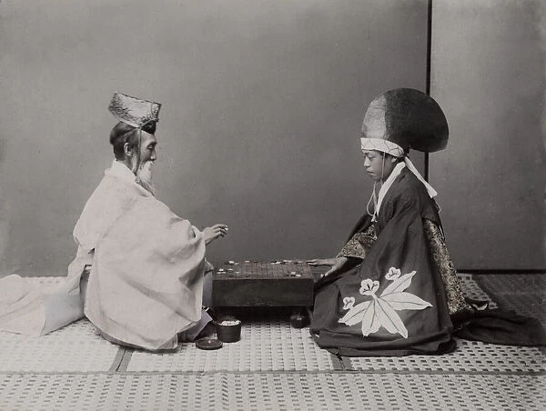 Shinto priests (actors) playing board game Go Japan