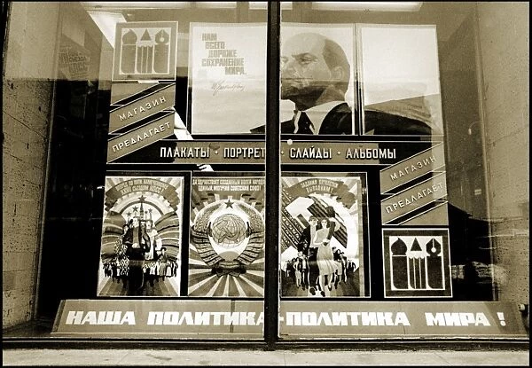 Soviet-era posters displayed in a window - Moscow
