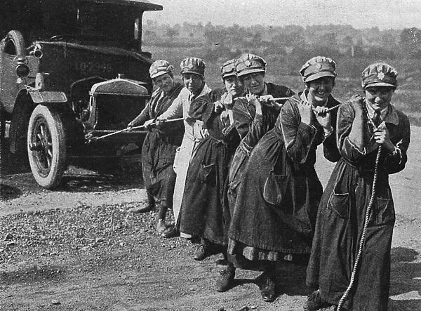 Womens Legion pulling a broken down ambulance, WWI