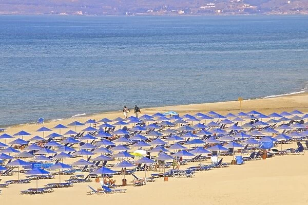 Beach and sunshades on beach at Giorgioupolis, Crete, Greek Islands, Greece, Europe
