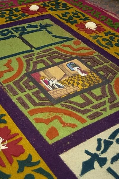 Close-up of coloured sawdust rug on the street on Good