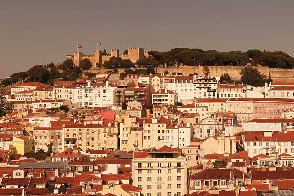 View over the old town to Castelo de Sao Jorge castle at sunset, Lisbon, Portugal, Europe