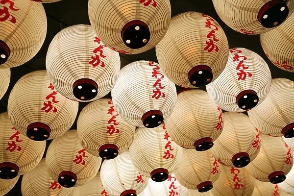 Night street scene of Japanese paper lanterns in Shinjuku, Tokyo, Japan