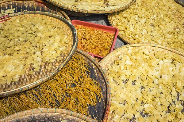 Cau Lau noodles drying in the sun on the street in Hoi An, Quang Nam Province, Vietnam