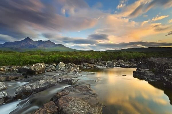 Isle of Skye, Scotland, Europe. The last sunset colors reflected in the water