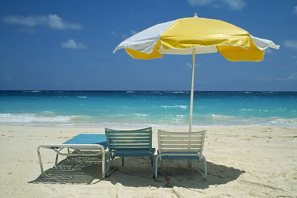 10025742. BERMUDA Long Bay Beach Umbrella and sun loungers on beach