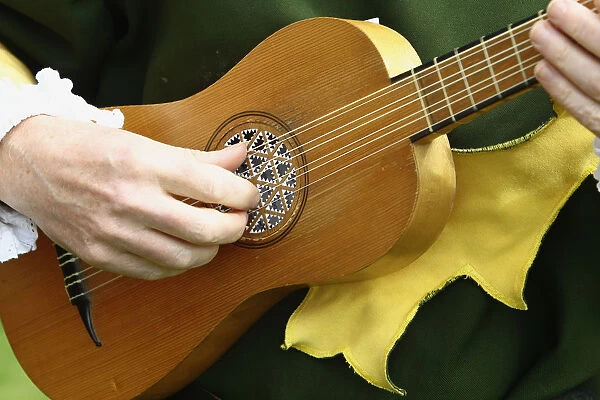 England, Kent, Replica Elizabethan Guitar being played by a historical re-enactment group