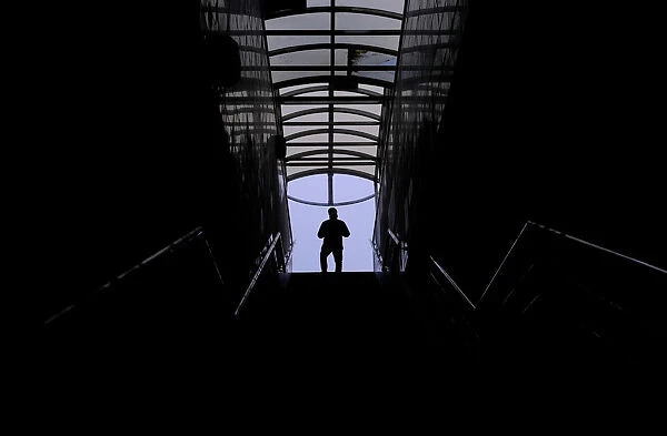 A man walks along a staircase in a pedestrian tunnel in Moscow