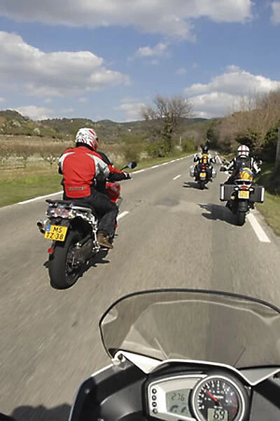 Motorbikers on country road