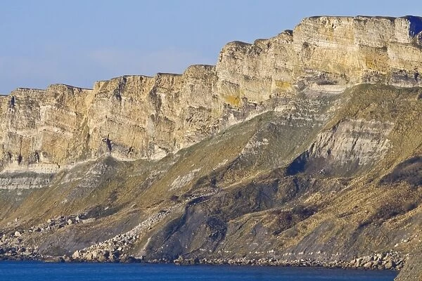 View of sea cliffs with folding of rocks, near Kimmeridge, Dorset, England, december