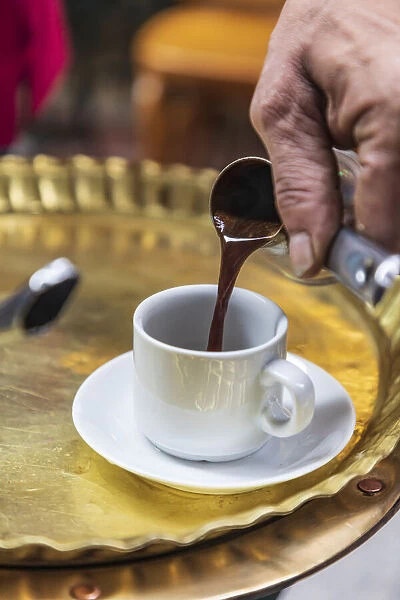 Africa, Egypt, Cairo. Egyptian coffee being served traditionally at a coffee shop in