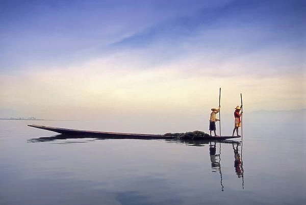 Asia, Burma, (Myanmar) Fishing boat reflected on Inle Lake