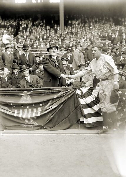 GEORGE H. RUTH (1895-1948). Known as Babe Ruth. American professional baseball player. Ruth shaking hands with President Warren G. Harding at Yankee Stadium, New York City, 24 April 1923. Also in the box are Doctor Charles Sawyer and Albert Lasker