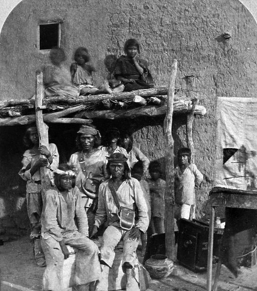 NEW MEXICO: ZUNIS, 1873. Group of young Zuni men at a pueblo village in New Mexico