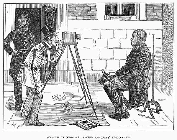 NEWGATE PRISON, 1873. Photographing inmates at Newgate prison in London. English wood engraving, 1873