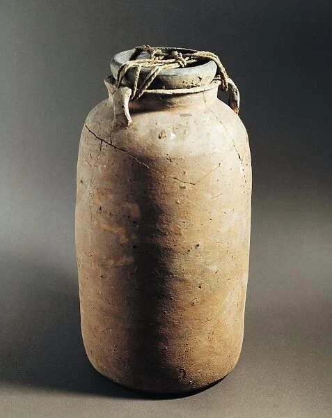 Egypt, Deir el-Medina, Jar filled with scrolled papyrus with Greek and Demotic scripts from a domestic archive, 188-101 B. C. clay