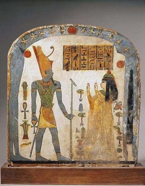 Painted wood stele of Lady Taperet, depicting Taperet praying god Aton with sky represented by goddess Nut