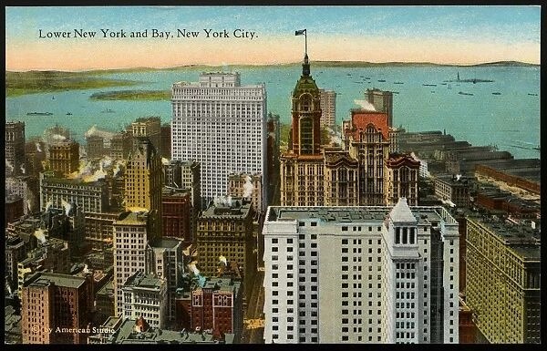 Postcard of Lower Manhattan and Bay. ca. 1919, Lower New York and Bay, New York City. LOWER MANHATTAN AND BAY FROM WOOLWORTH BUILDING, NEW YORK CITY. In this comparatively small and congested district are located the largest and most noted office Buildings in the world. New York Bay is the southern boundary, and the Hudson and East Rivers form the eastern and western boundaries