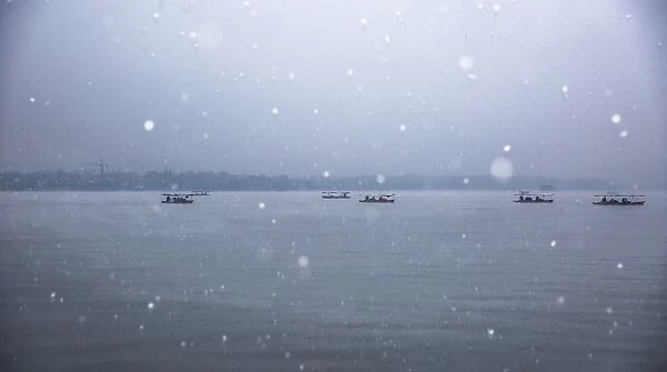 Scenic View Of Silhouette Boats On the West Lake In Snow, Hangzhou