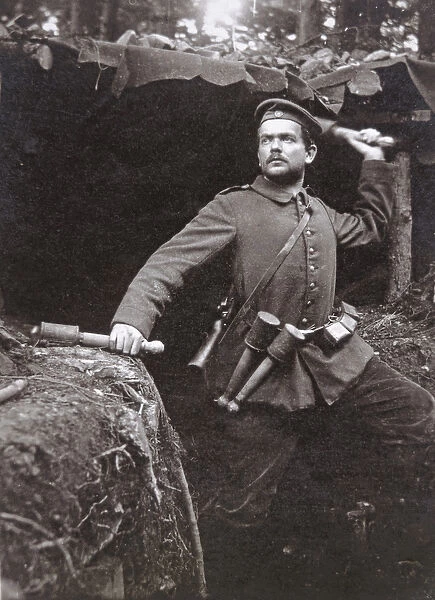 WWI German grenadier armed with stick grenades, 1915 (b  /  w photo)