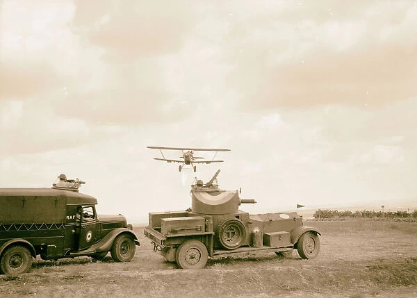 R. A. F activities Plane immediately armoured car