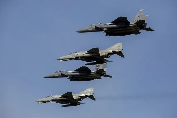 A mixed formation of U. S. Air Force F-15E Strike Eagles and Hellenic Air Force F-4E