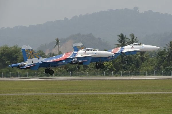 Two Sukhoi Su-27 Flanker of the Russian Knights aerobatic team taking off