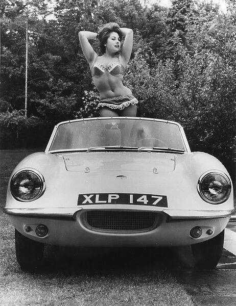 1959 Elva with posing female model. Creator: Unknown