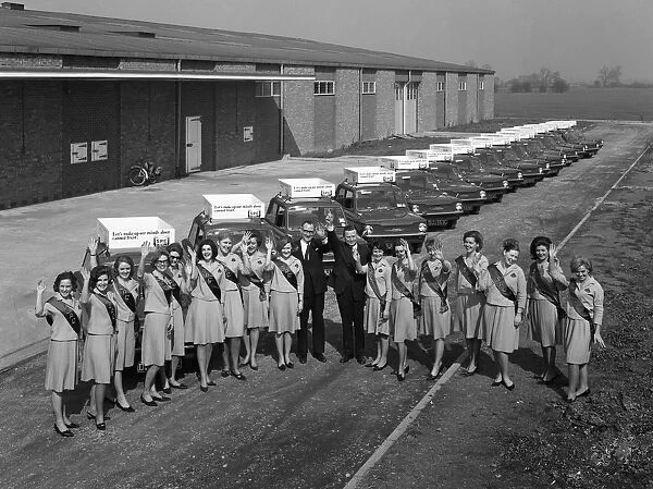 Australian sales girls in front of a fleet of 1965 Hillman Imps, Selby, North Yorkshire, 1965
