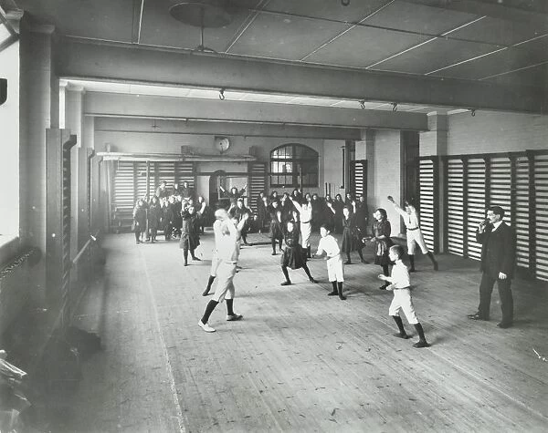 Boys and girls playing netball, Cable Street School, Stepney, London, 1908