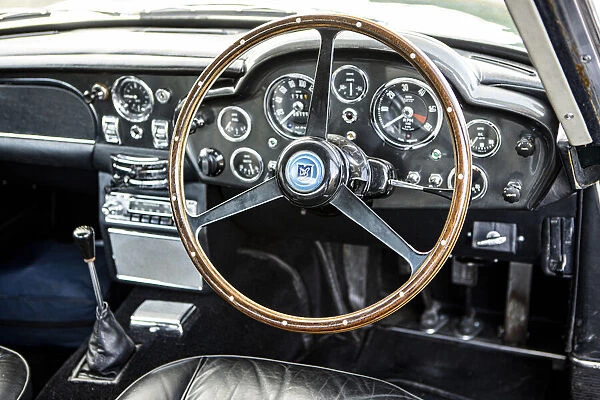Steering wheel and dashboard of a 1965 Aston Martin DB5. Creator: Unknown