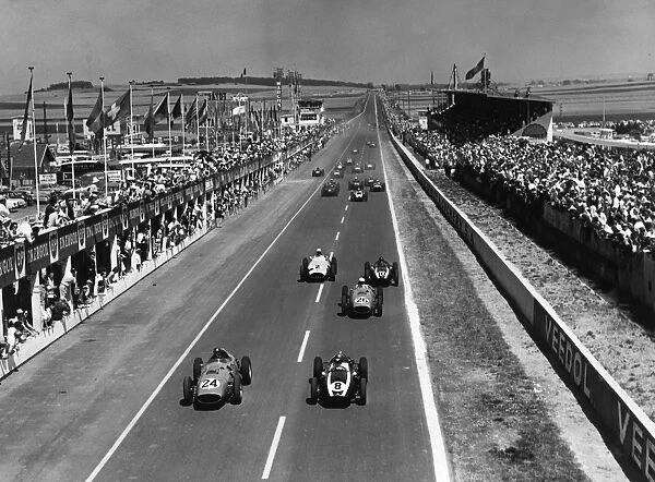 1959 French Grand Prix - Start: Tony Brooks, #24, 1st position, and Jack Brabham, , 3rd position, lead at the start. Phil Hill, , 2nd position