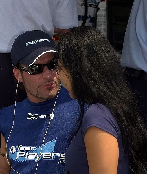 Alex Tagliani gets some advice from girlfiend Bronte Kok prior to qualifying for the Molson Indy Toronto. Exhibition Place, Toronto, Ont. Ca. 06
