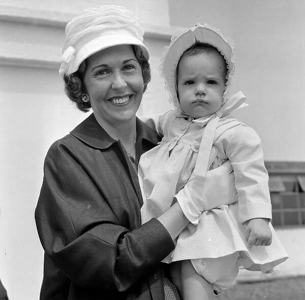Barbara Riese, (wife of tennis player Fred Perry) pictured with their daughter Penny who