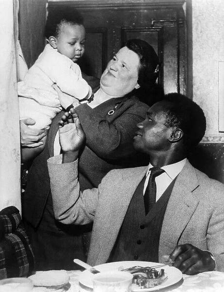 Boxer Hogan Bassey, pictured with Bessie Braddock at his home in Liverpool, Mrs