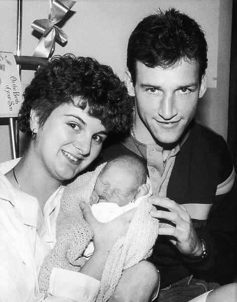 Everton footballer Dave Watson with his wife and new born baby, December 1986