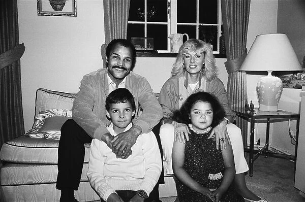 Ex-World Boxing Champion John Conteh at home with wife Veronica and two children